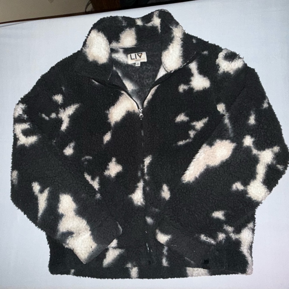 Women’s Fleece Jacket in a cow print pattern